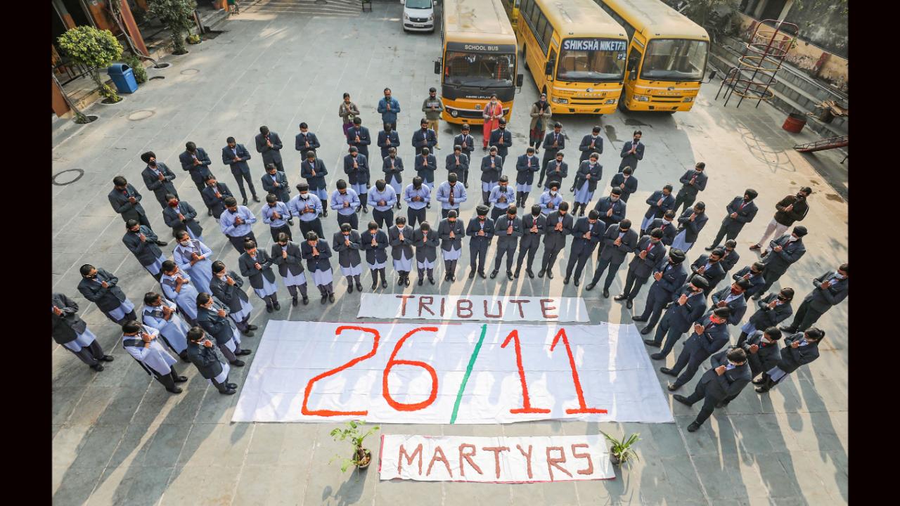 In addition to Mumbaikars, people across the nation also paid homage to the departed souls with folded hands, bowed heads, lighting candles, offering flowers or wreaths, at the Martyrs' Memorial and other locations in the city. School students pay tribute to the martyrs of the 26/11 Mumbai terror attacks in Jammu. File pic/PTI